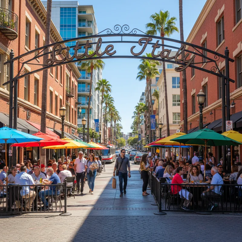 The iconic Little Italy neighborhood sign arching over a bustling India Street in San Diego, California, with restaurants and pedestrians below.